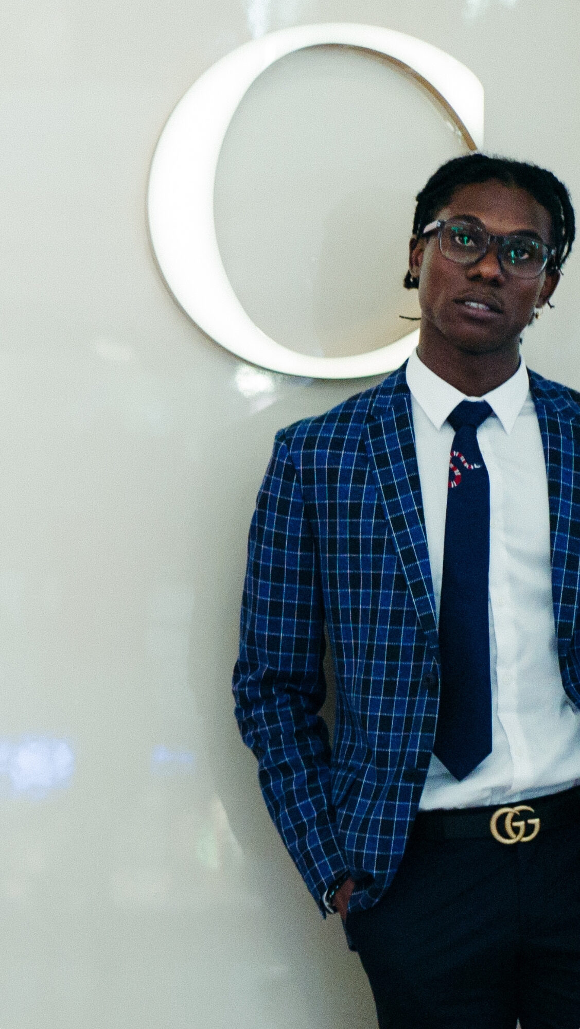 Elijah Snoz portrait in a blue check suit
